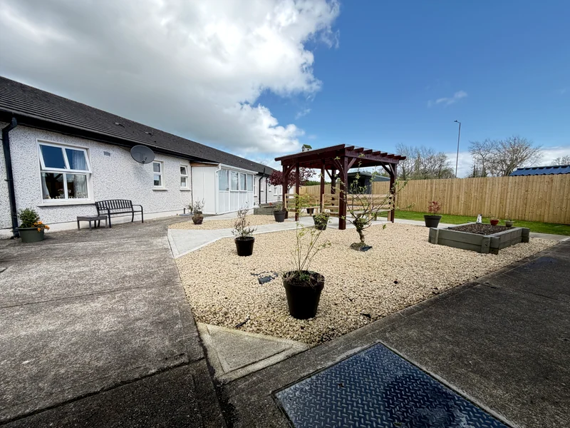 Enclosed garden and walkway at Rivervale Nursing Home